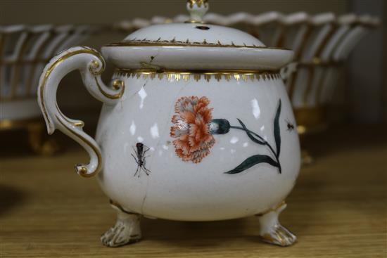 A 19th century Meissen jug and cover, cracked, 12.5cm., a Berlin gilt porcelain basket, another similar basket